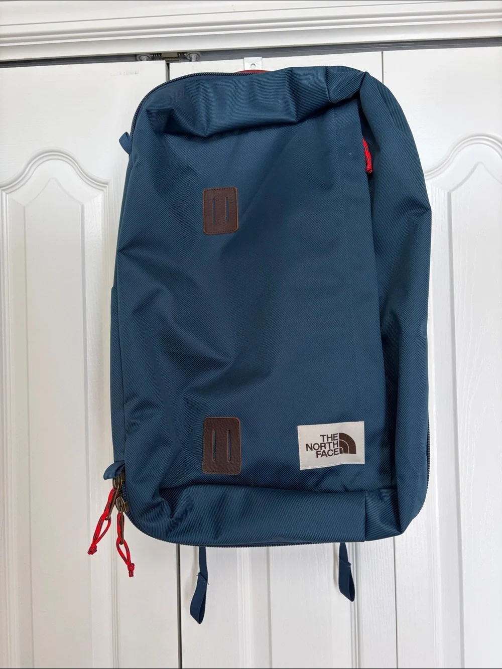 The North Face Travel Duffel Blue Backpack with Red Accents